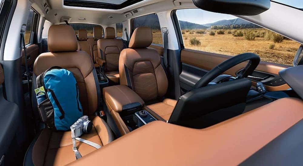 The black and brown interior in a 2024 Nissan Pathfinder is shown.