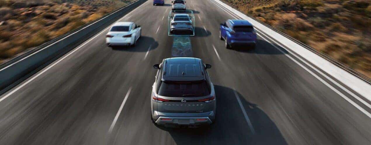 A grey 2024 Nissan Pathfinder is driving with a simulated ProPILOT Assist radar.