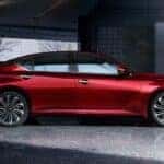 A red 2024 Nissan Altima SR is shown parked on a driveway.