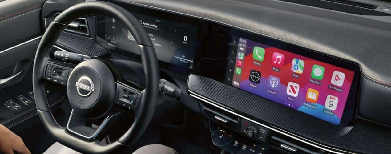 The black interior and dash in a 2025 Nissan Kicks is shown.
