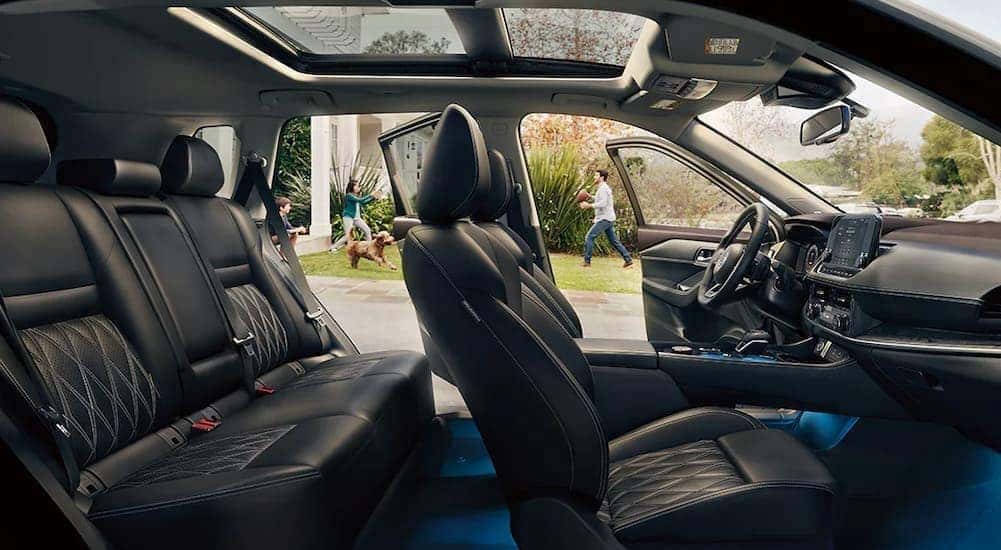 The black interior and dash in a 2024 Nissan Rogue is shown.