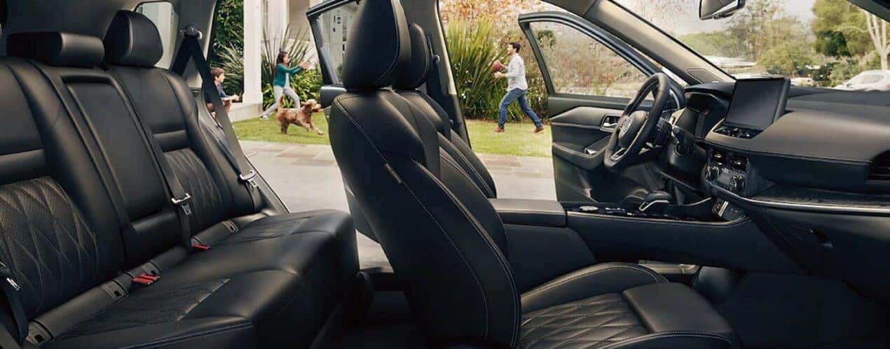 The black interior and dash in a 2024 Nissan Rogue is shown.