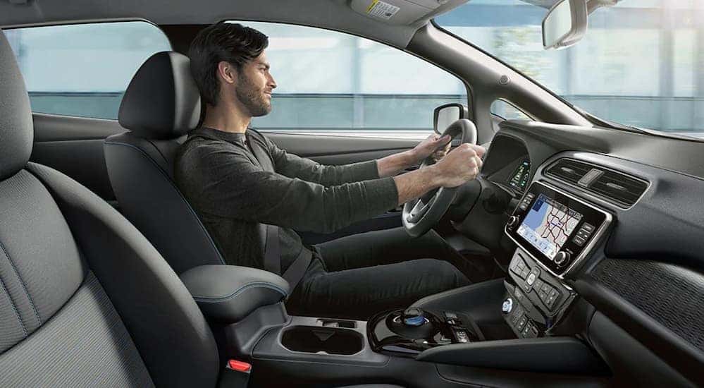 The black interior and dash in a 2025 Nissan Leaf SV Plus is shown.