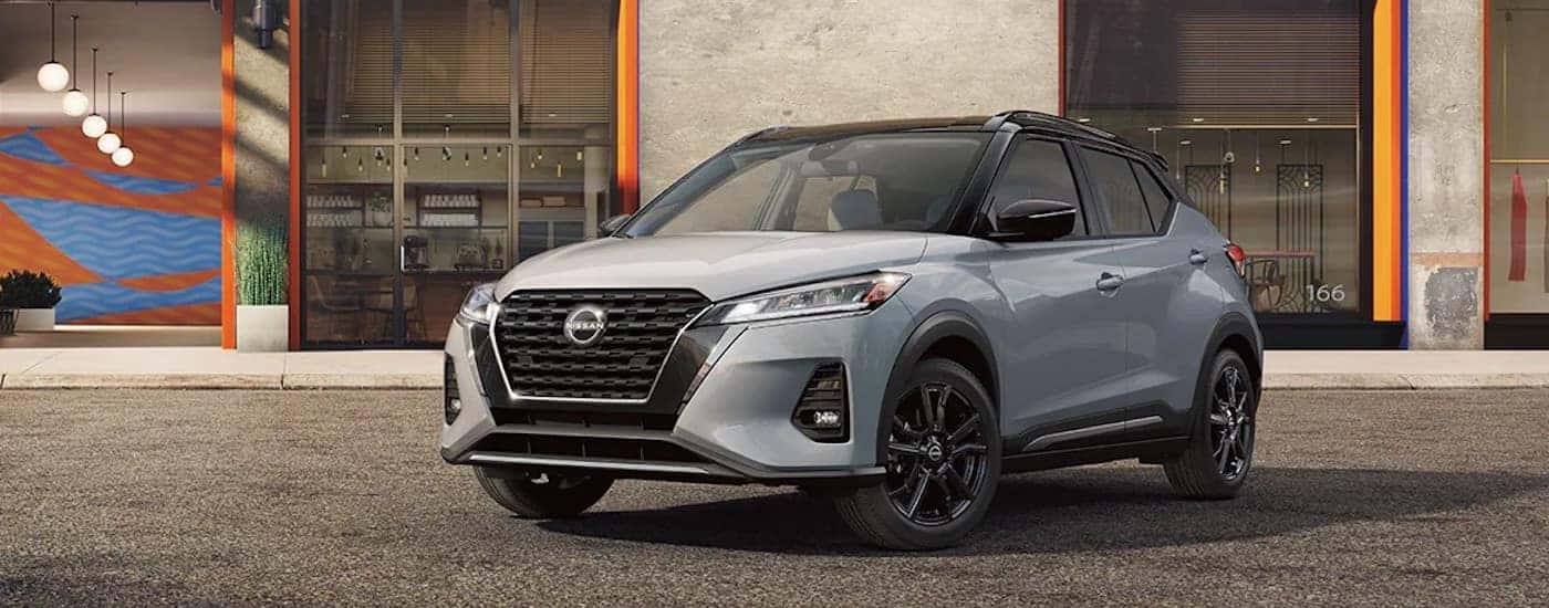 A grey 2023 Nissan Kicks is shown from the front at an angle.