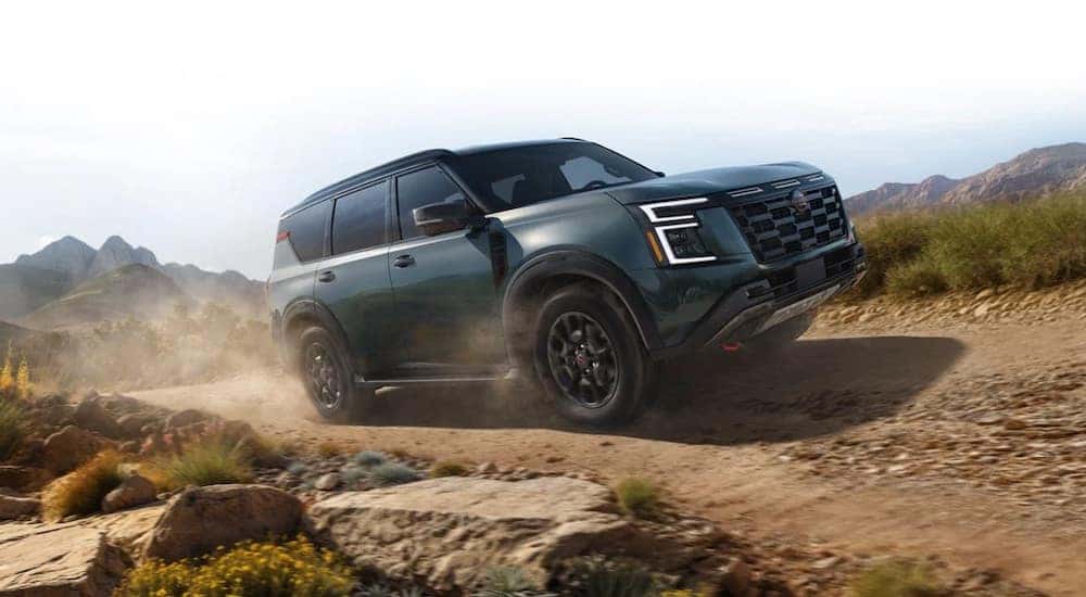 A green 2025 Nissan Armada is shown from the front at an angle.