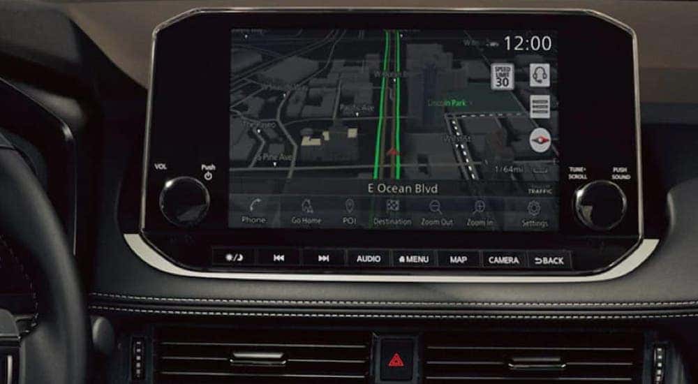 The infotainment screen and navigation display in a 2021 Nissan Rogue, one of many used cars for sale.