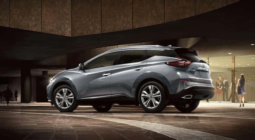 A silver 2024 Nissan Murano is shown parked on a marble floor.