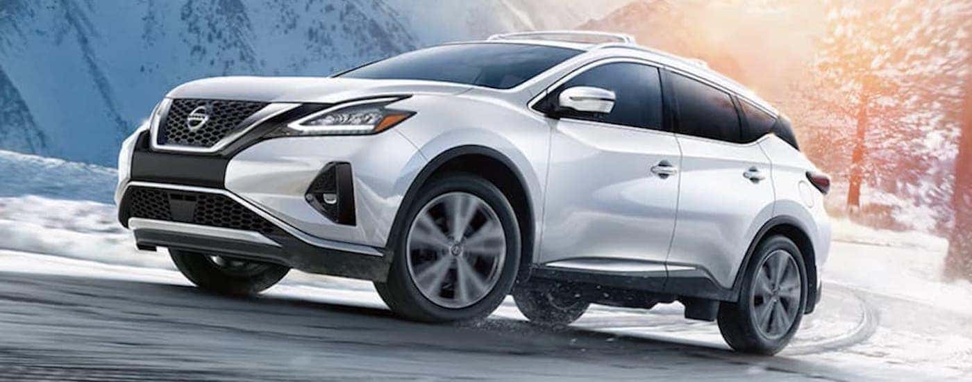 A white 2021 Nissan Murano is shown from the side.