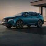 A blue 2025 Nissan Murano Platinum is parked in a driveway.