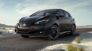 A 2024 Nissan LEAF SV Plus is shown parked near an ocean aftervisiting a Nissan dealer near Monticello.