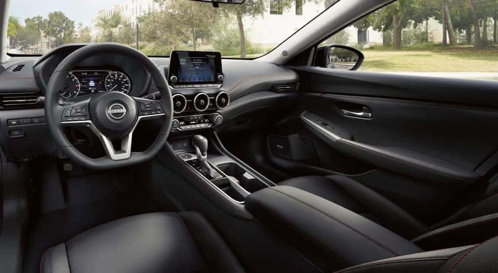The black interior and dash are shown in a 2025 Nissan Sentra.