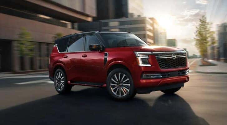 A red 2025 Nissan Armada is shown from the front at an angle.