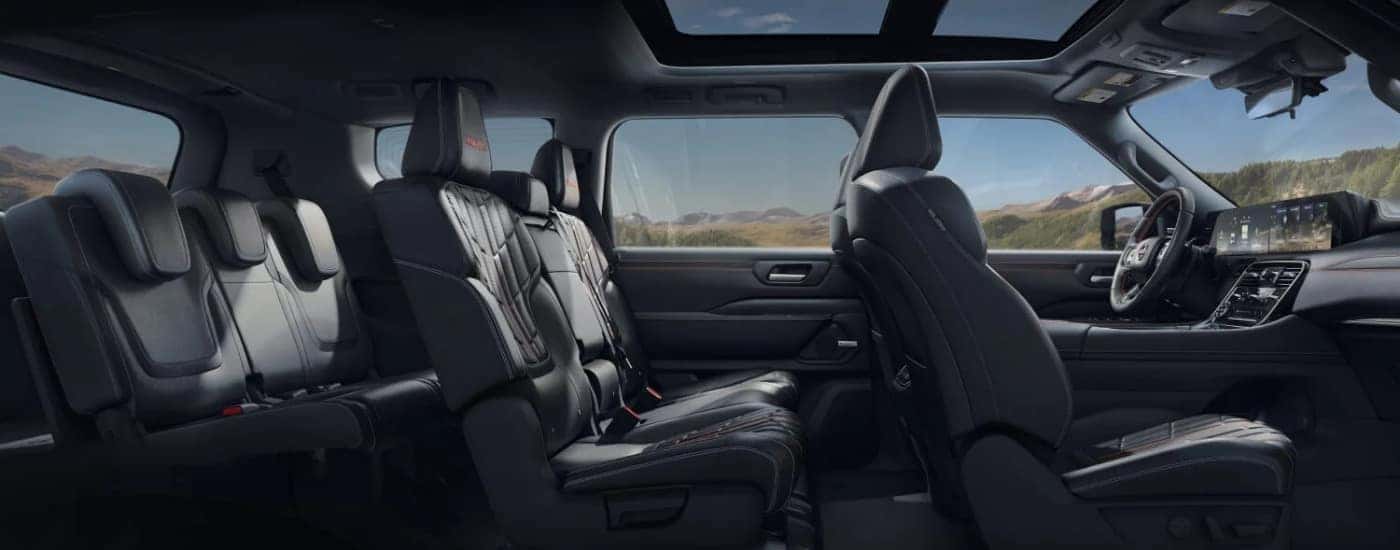 The black interior of a 2025 Nissan Armada is shown from the side.