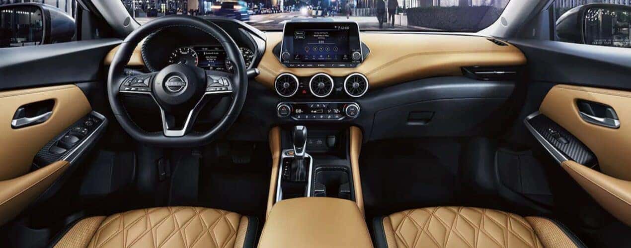 The black and tan interior and dash are shown in a 2025 Nissan Sentra.