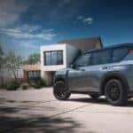 Rear view of a grey 2025 Nissan Armada XL parked on a driveway.