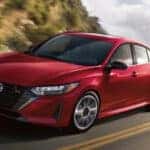 A red 2025 Nissan Sentra for sale in Champaign is shown from the front at an angle.