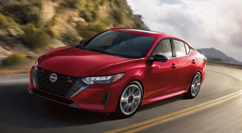 A red 2025 Nissan Sentra for sale in Champaign is shown from the front at an angle.