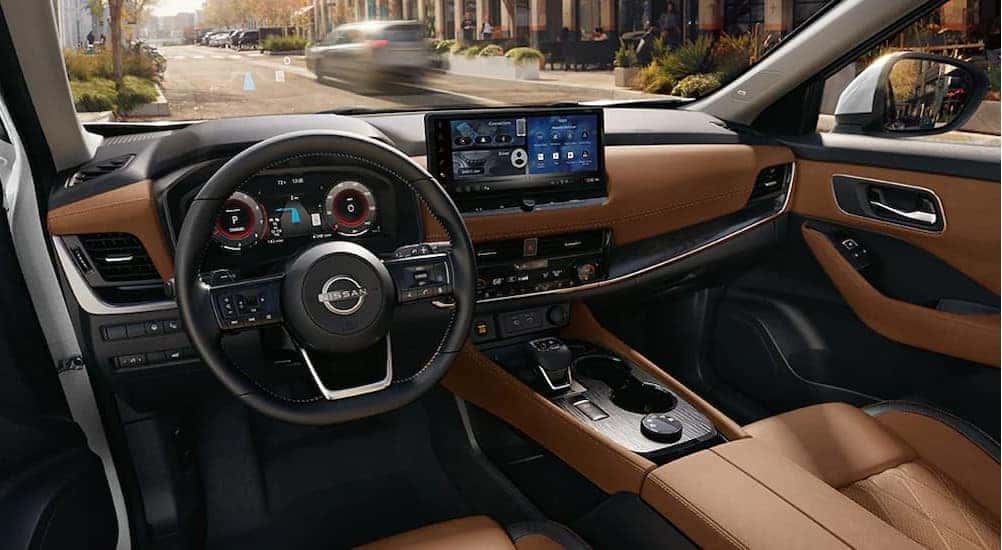 The black and brown interior in a 2025 Nissan Rogue for sale near Danville.