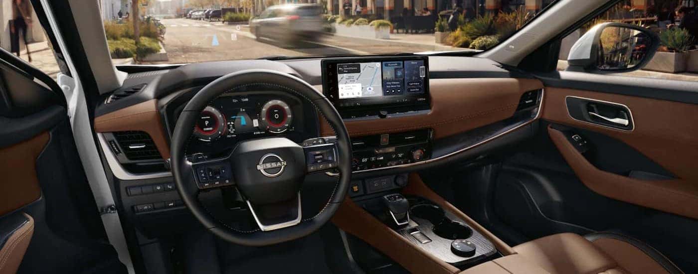 The black and brown dash in a 2025 Nissan Rogue Platinum.