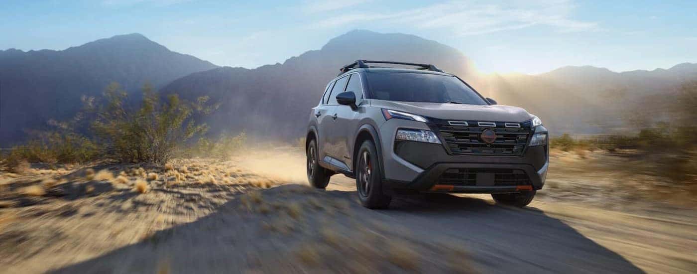 A gray 2025 Nissan Rogue Rock Creek off-roading.