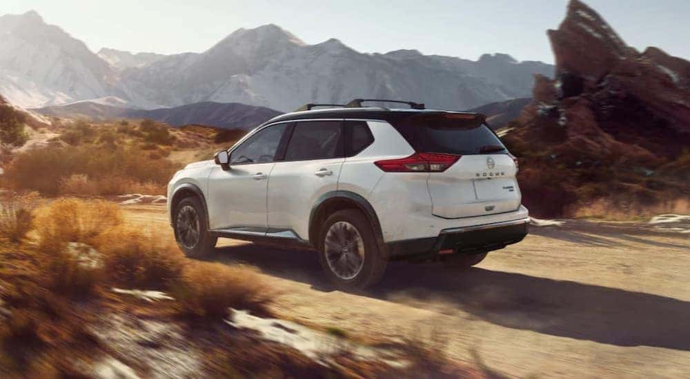 A white 2025 Nissan Rogue off-roading.