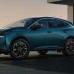 A blue 2025 Nissan Murano parked in a driveway