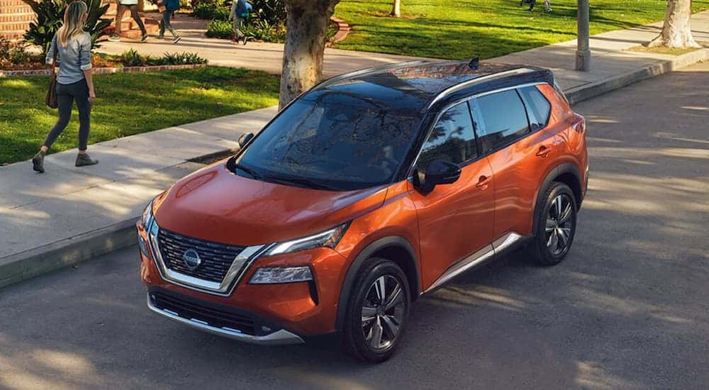 An orange used 2021 Nissan Rogue available from a dealer with used cars for sale near Urbana