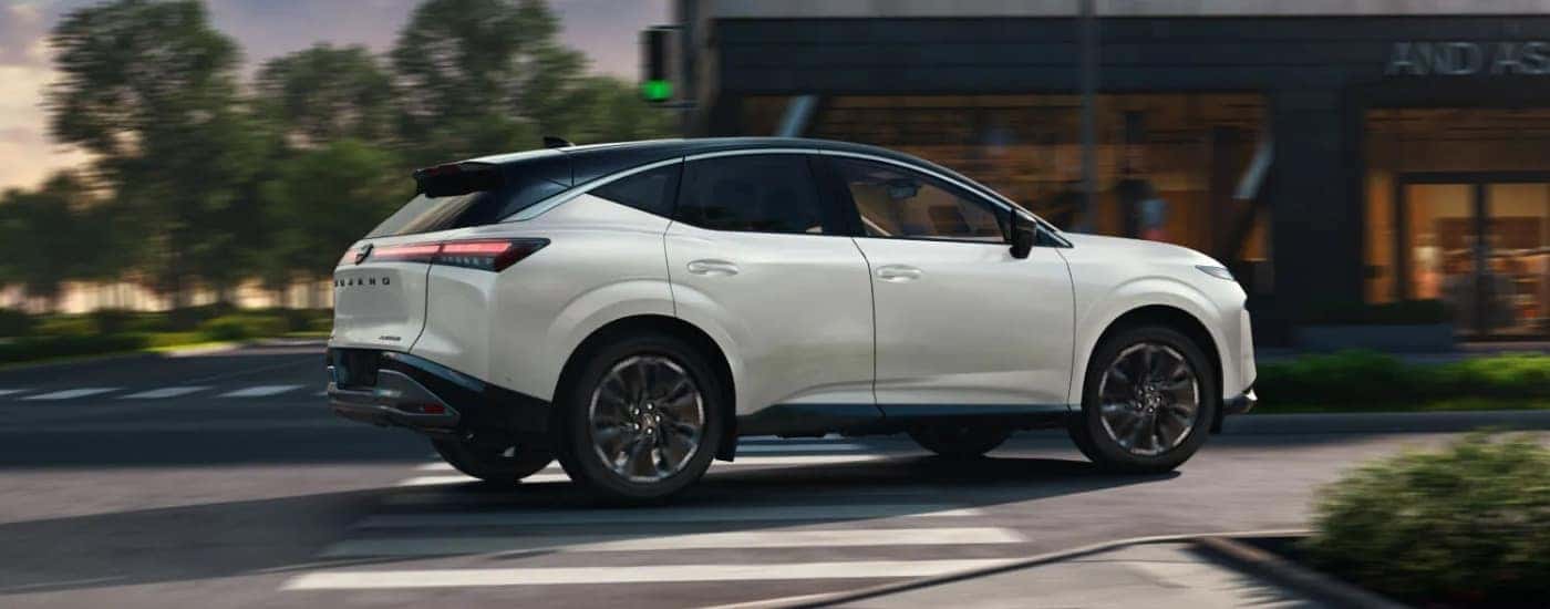 A white 2025 Nissan Murano from the side.