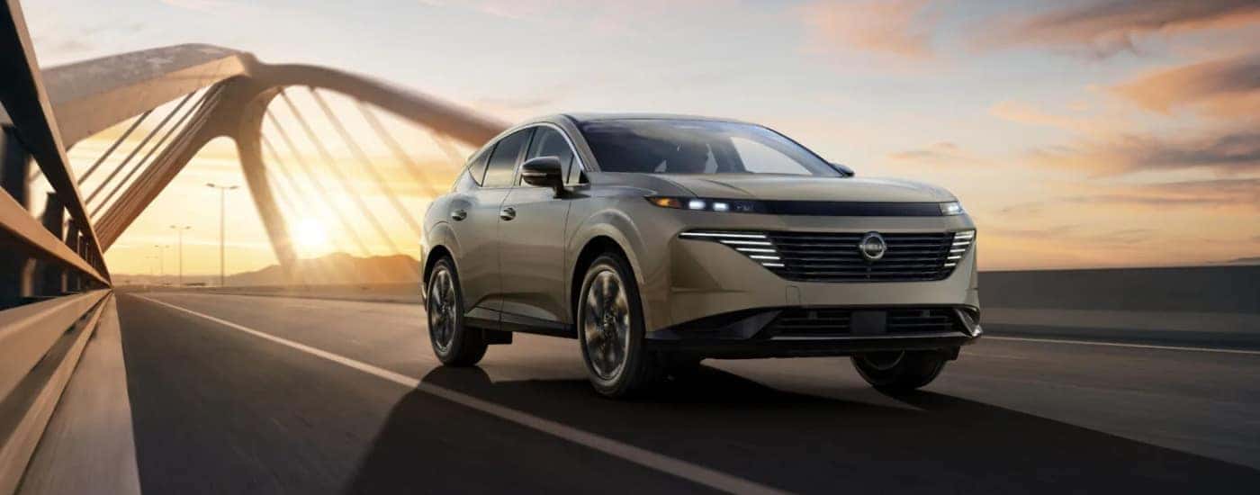 A tan 2025 Nissan Murano from the front at an angle.
