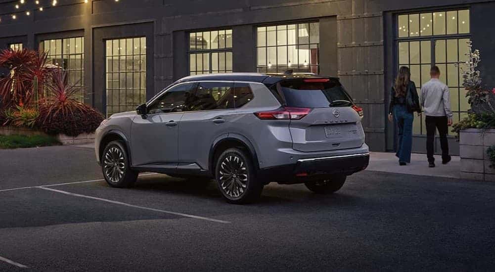A gray 2025 Nissan Rogue parked on a parking spot.