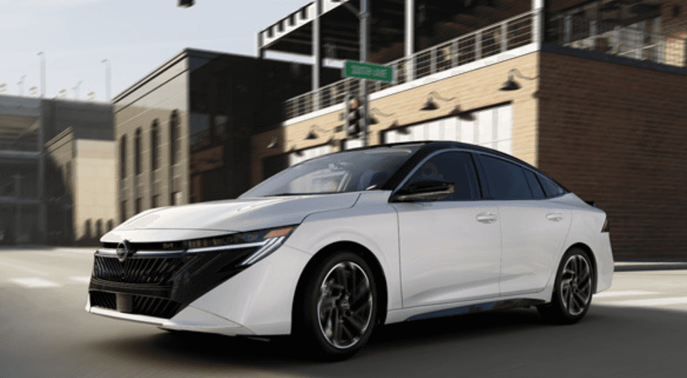 White 2026 Nissan Sentra RS driving down the road