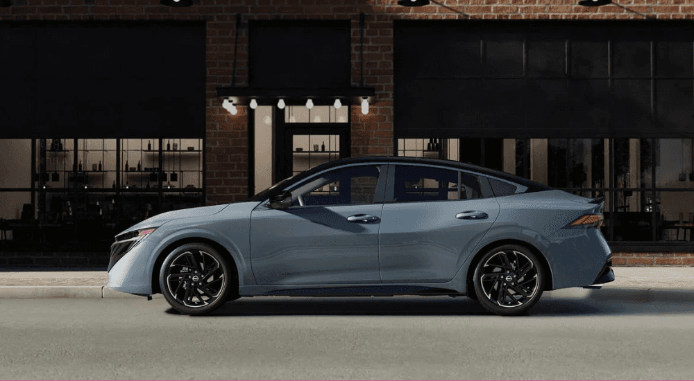 A blue 2026 Nissan Sentra parked in a city