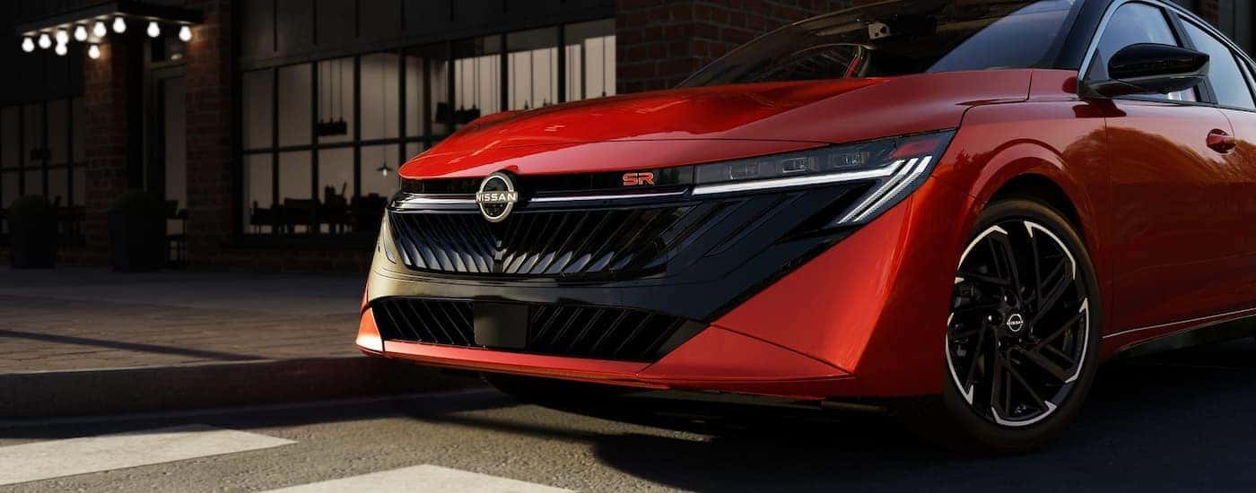 Front grille on a red 2026 Nissan Sentra SR parked