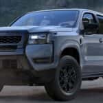 A gray 2026 Nissan Frontier Dark Armor parked off-road.