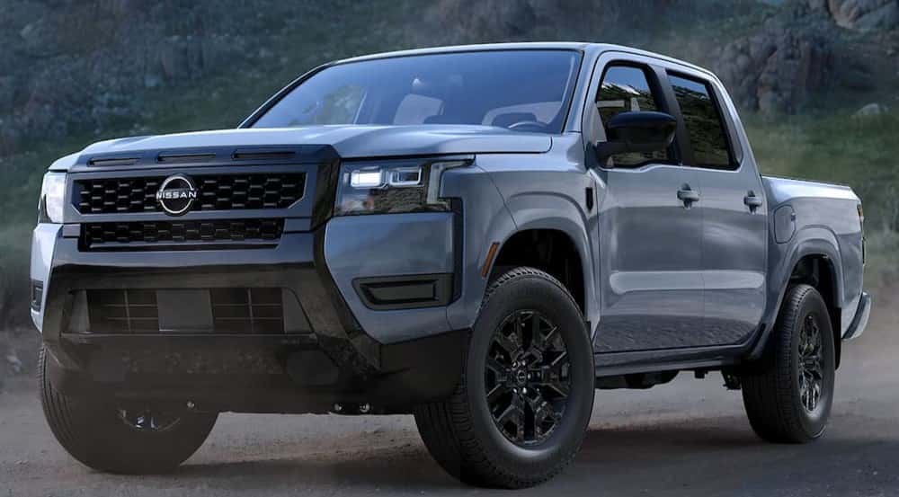 A black 2026 Nissan Frontier Dark Armor parked off-road.