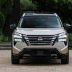 A silver 2026 Nissan Rogue parked on a driveway.