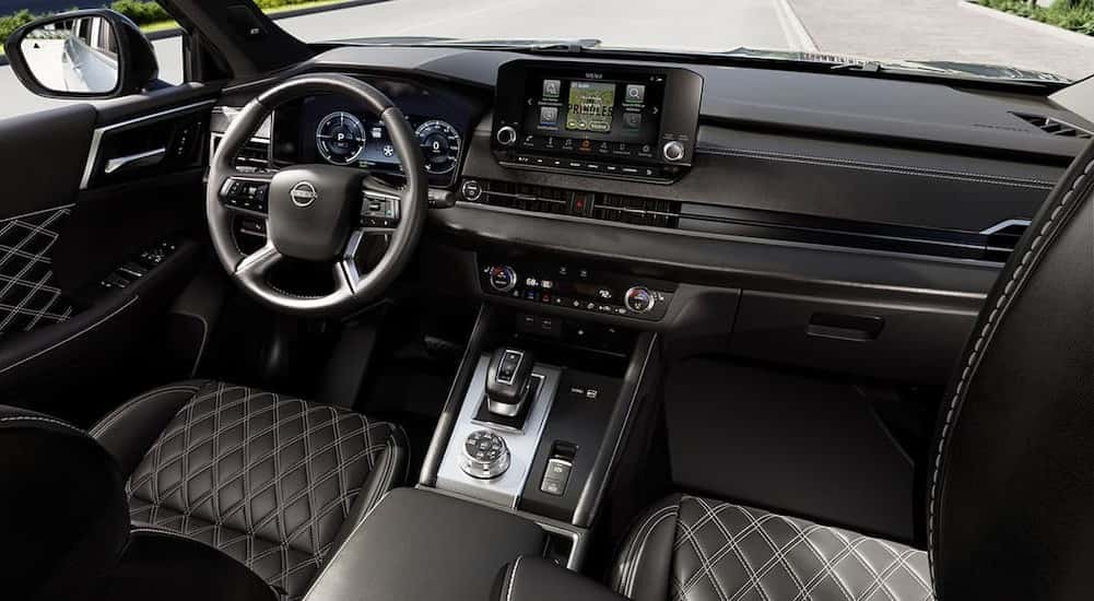 Black dash in a 2026 Nissan Rogue PHEV for sale in Champaign.