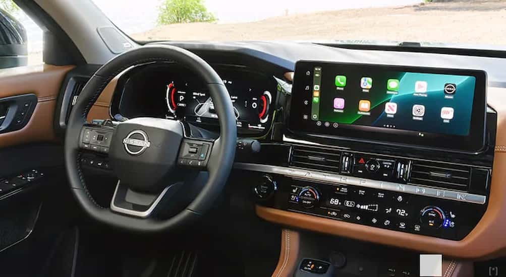 The black and brown dash in a 2026 Nissan Pathfinder for sale near Urbana.