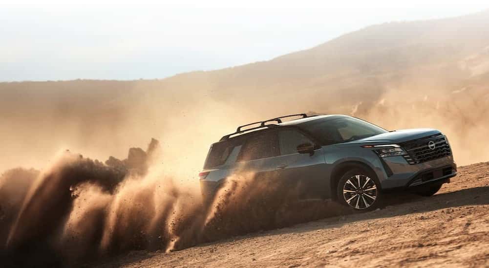 A gray 2026 Nissan Pathfinder off-roading.