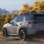 A gray 2026 Nissan Pathfinder driving offroad.