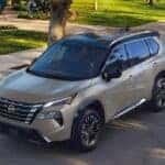 Grey 2026 Nissan Rogue parked near a curb.