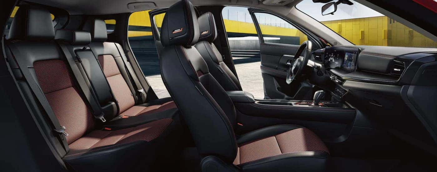 Black and red leather interior inside a 2026 Nissan Kicks