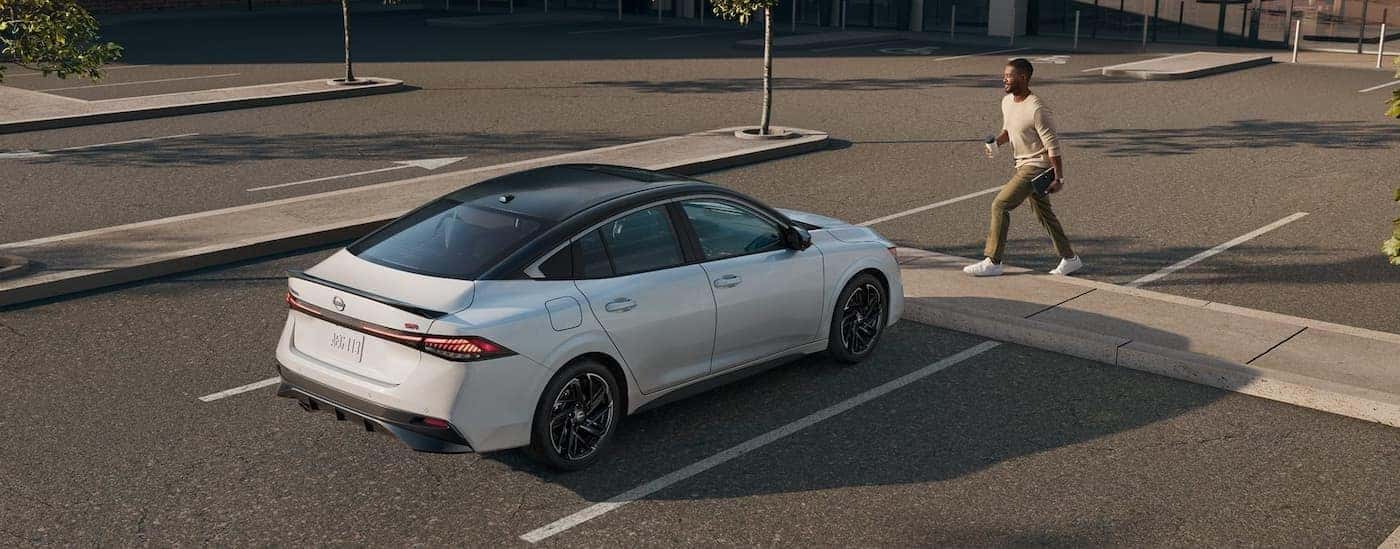 A white 2026 Nissan Sentra SR stopped at a crosswalk.
