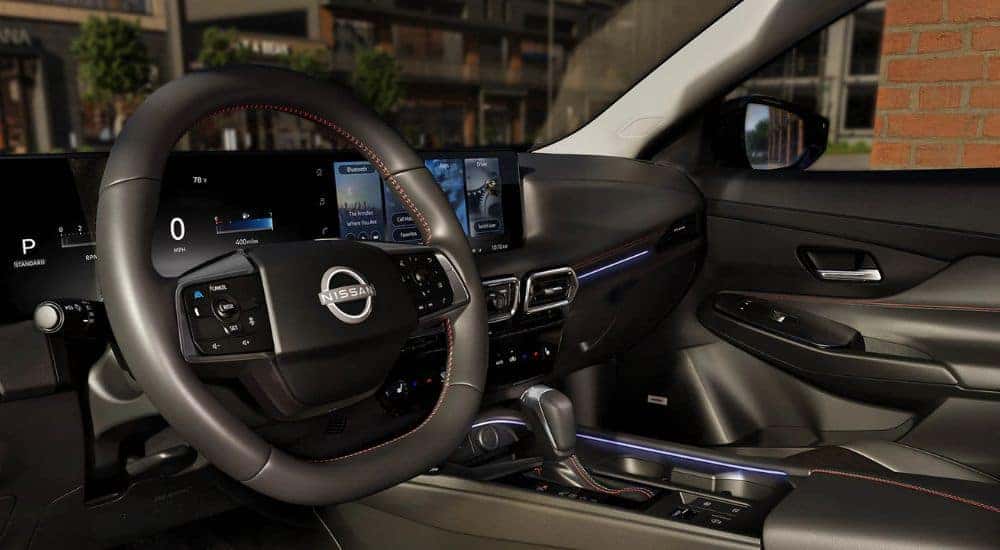 2026 Nissan Sentra wrapped steering wheel and view from driver's side