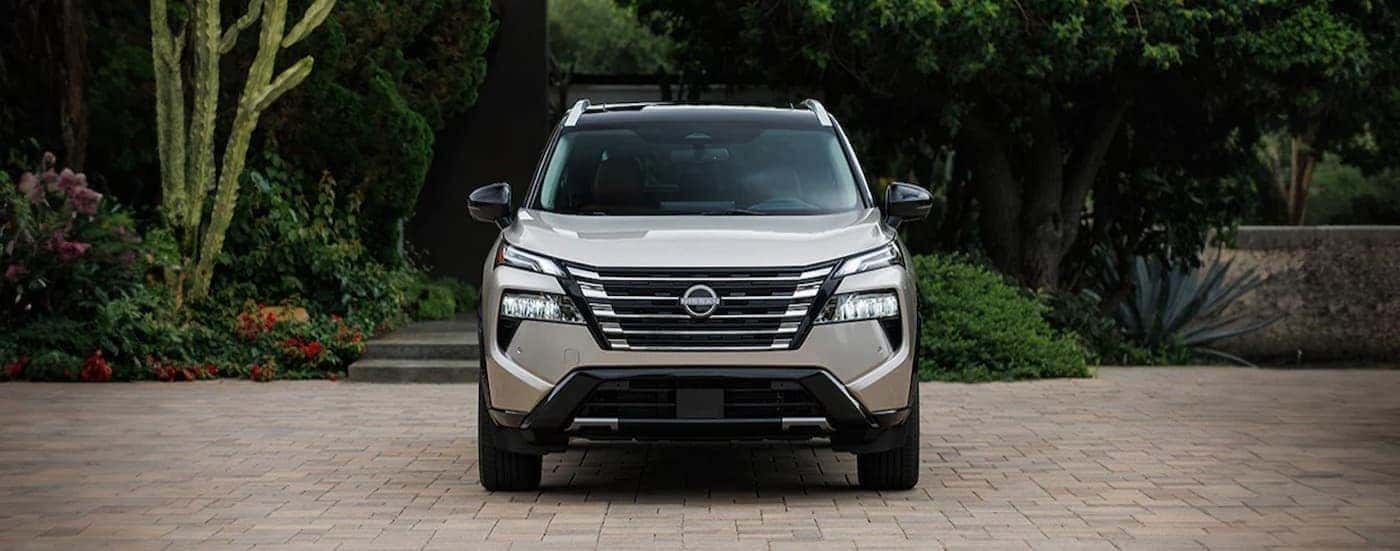 A silver 2026 Nissan Rogue parked on a driveway.