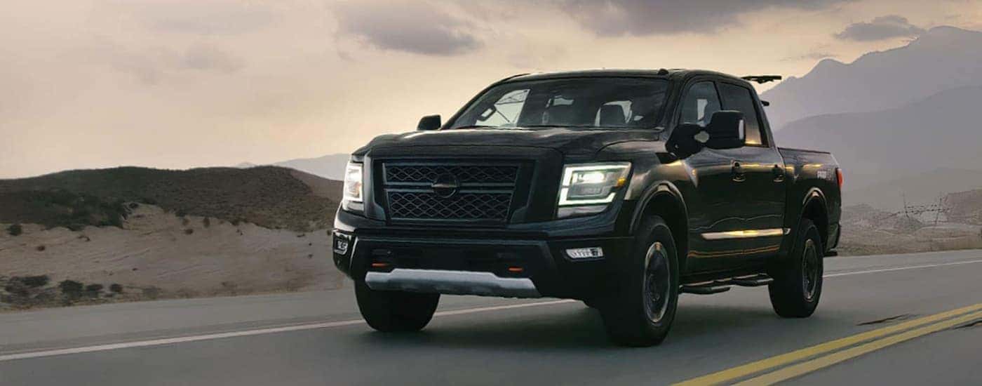 Black 2020 Nissan Titan Pro4X driving on a road