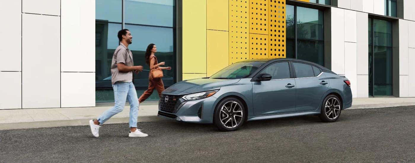 Grey 2025 Nissan Sentra parked on the side of a street