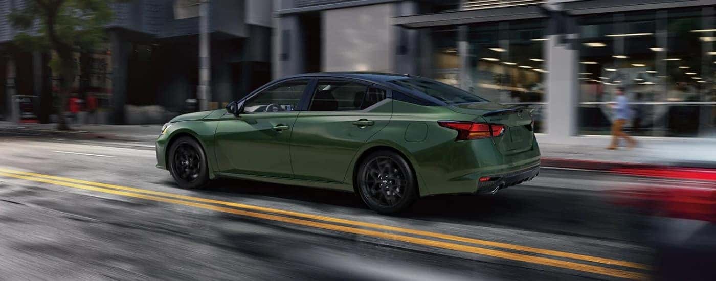 Green 2026 Nissan Altima SR driving on a city street