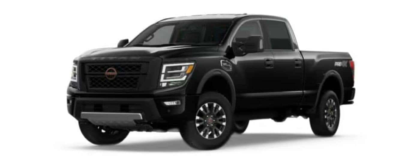 A black 2022 Nissan Titan XD with a white background.