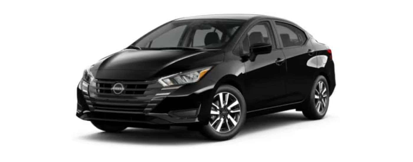 A black 2022 Nissan Versa with a white background.
